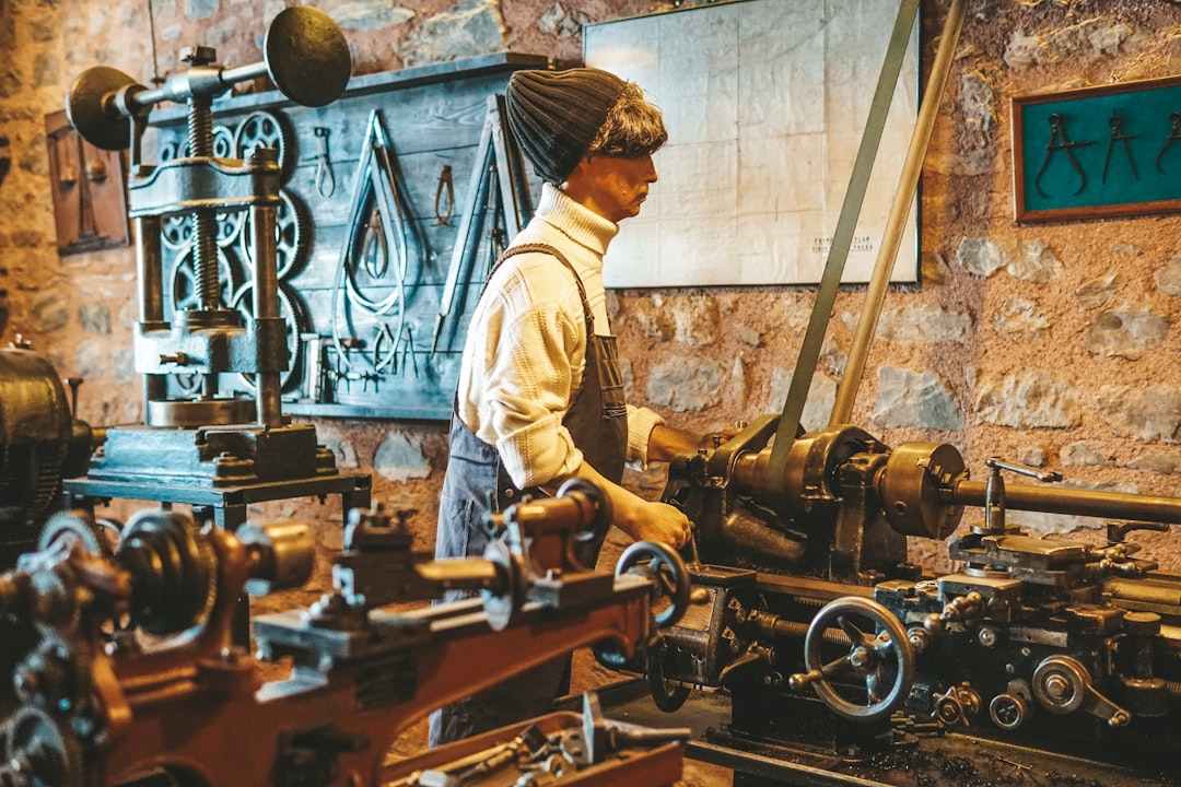 a man working on a machine in a factory