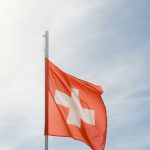 A red and white flag flying in the sky