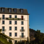 a hotel with a sign that reads palace hotel