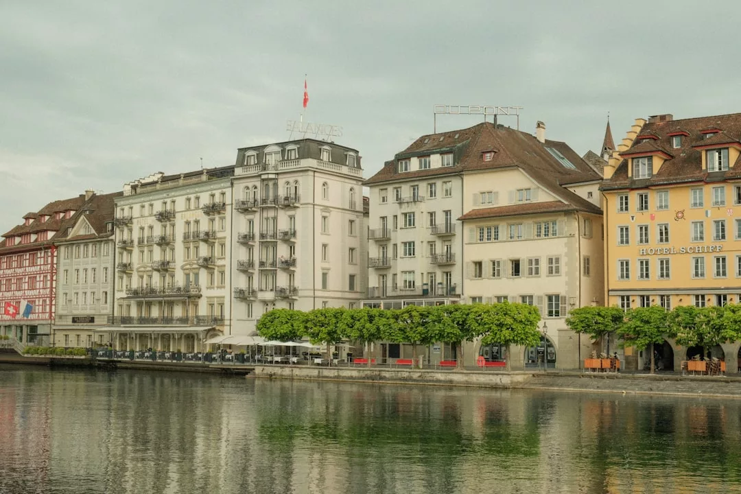 a row of buildings next to a body of water