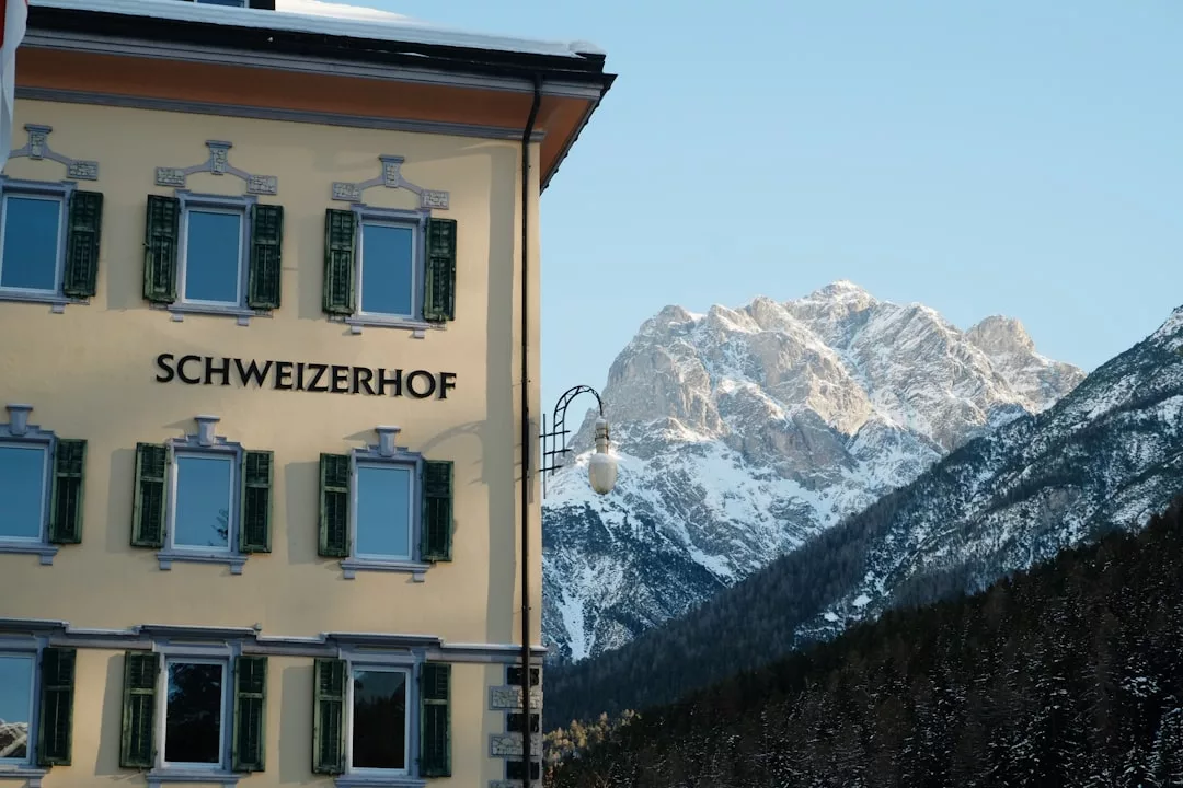 A hotel with a mountain in the background