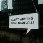 white and black wooden sign