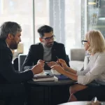 a group of people sitting around a table