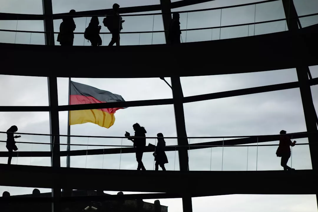 a group of people standing on a bridge holding a flag