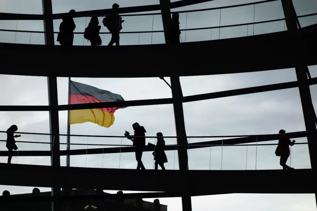 a group of people standing on a bridge holding a flag